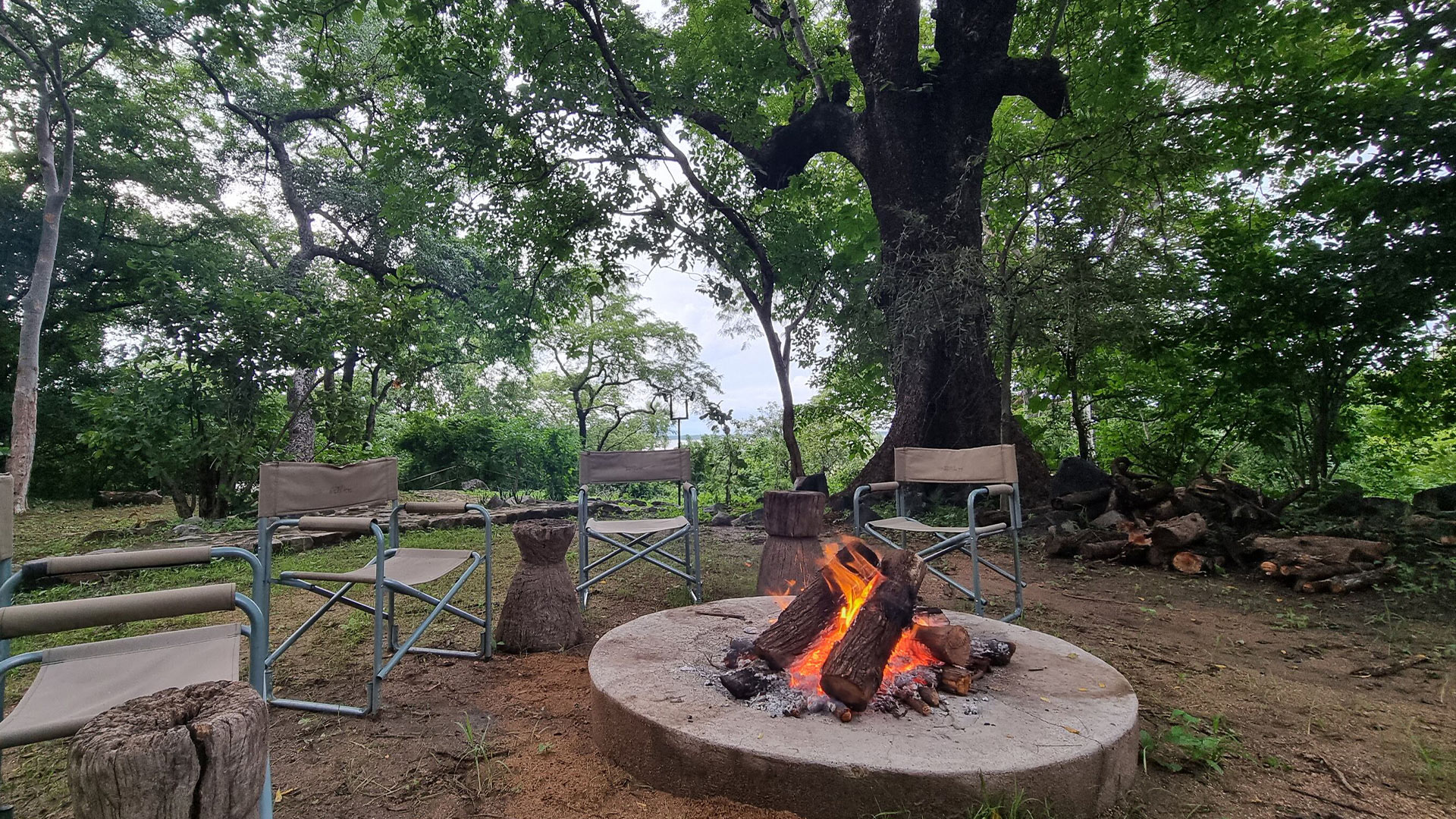 Chairs around a camp fire in Chimwala Camp 