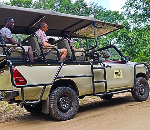 People in a vehicle on a game drive in Liwonde National Park