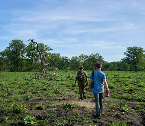 A guide walking a tourist through Liwonde Park